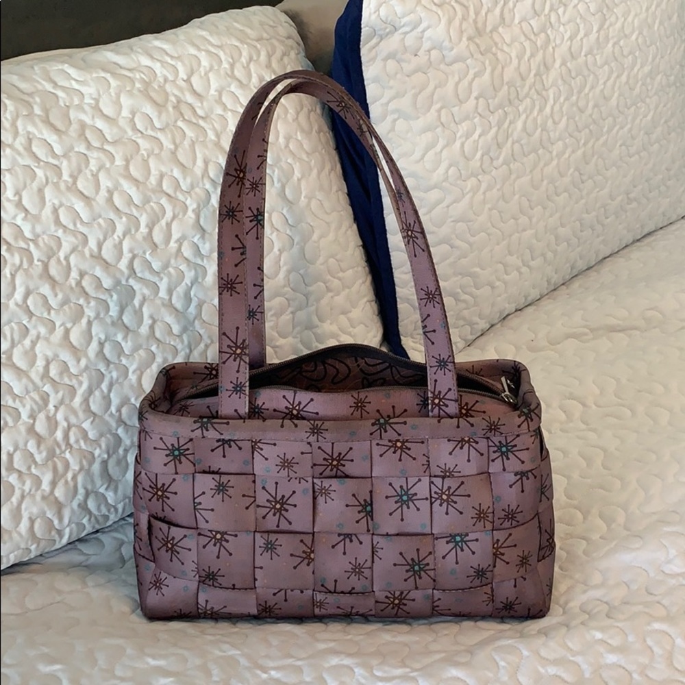 Harvey’s large satchel.